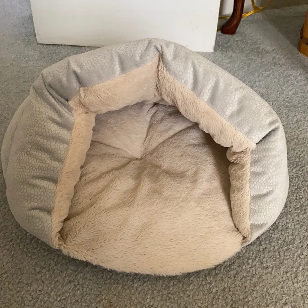 Cat or dog bed (small animals)it is about 1foot wide and 1foot tall when opened.